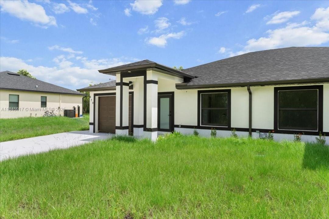 668/670 chemstrand st e, Lehigh Acres, Florida 33974